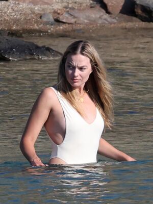 Margot Robbie in a swimsuit on the beach in Greece